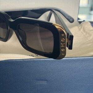 Louis Vuitton Women's Sunglasses in Black with Gold Detail